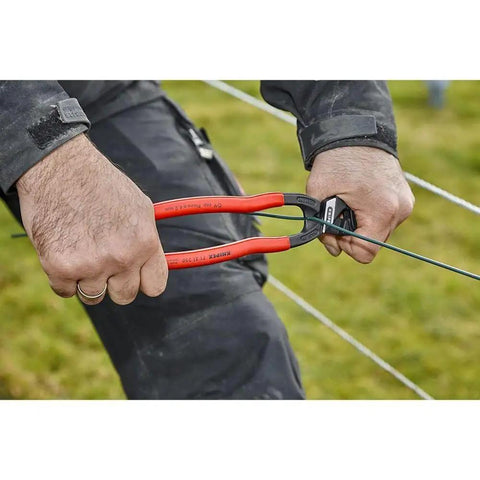 Person using CoBolt Compact Bolt Cutter With Notched Blade, 10-Inch Heavy Duty Wire Cutter For Bolts Nails Rivets Up To 1/4 Inch
