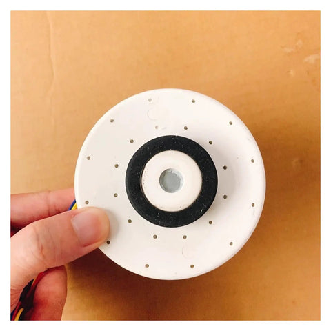 Hand holding brushless DC indoor fan motor for air conditioners replacement for MFD 24CXT quiet energy efficient DIY friendly
