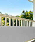 Grey soft padding panel with tie straps on stair rail for kids spaces, showing soft padding panels for kid spaces and stairs rails with tie straps edge guard for play areas floor beds and indoor safety zones grey anti collision edge protection for nurseries and playrooms easy install and durable padding.