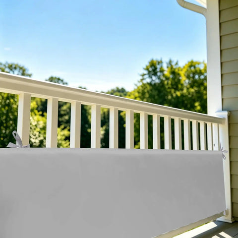 Grey soft padding panel with tie straps on stair rail for kids spaces, showing soft padding panels for kid spaces and stairs rails with tie straps edge guard for play areas floor beds and indoor safety zones grey anti collision edge protection for nurseries and playrooms easy install and durable padding.