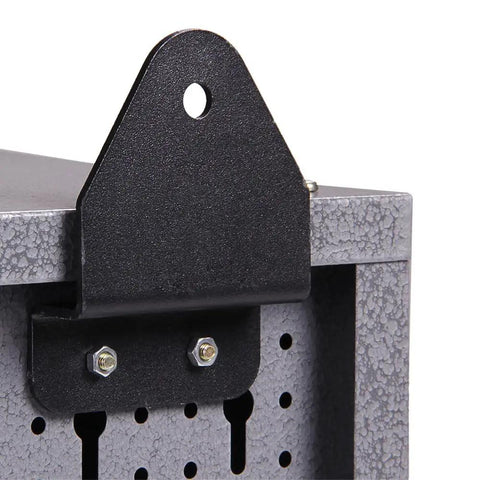 Close-up of a black and grey metal wall cabinet with lockable door, pegboard interior, and sturdy construction for tool storage.