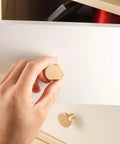 Hand installing Brushed Brass Cabinet Knobs Set Of 8 with screws and screwdriver 20x25 mm solid brass hardware on drawer