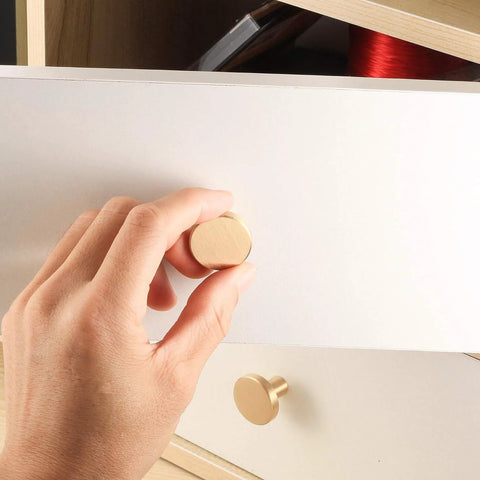 Hand installing Brushed Brass Cabinet Knobs Set Of 8 with screws and screwdriver 20x25 mm solid brass hardware on drawer