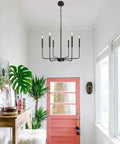 Black Farmhouse Chandelier With 6 Lights, 26.1 Inch Wide Adjustable Height Rustic Hanging Light Fixture in white entryway.