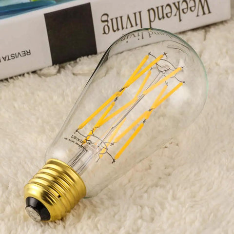 Old School Edison Style LED Bulb 10W Dimmable, 100W Equivalent, Clear Glass, Warm White 2700K, 1200Lm, E26 Base on carpet
