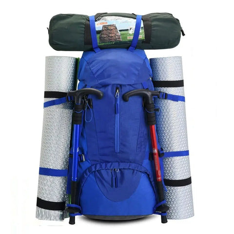 Blue huge capacity outdoor hiking backpack for mountaineering and camping with gear attached, lightweight waterproof build.
