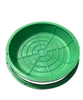 Top view of a green circular resin cover with grid pattern, part of Beefed Up Resin Sump Cover With Frame For Garage Floor Drain.