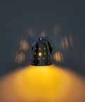 Silver Brass Wall Sconce, Mid Century Cone Lamp, Perforated Spotlight illuminating unique shadows on the wall.