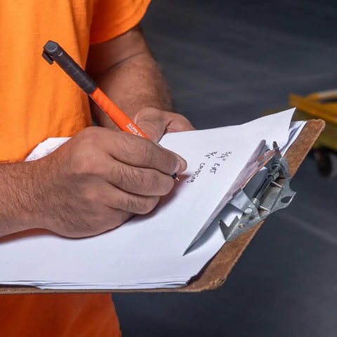 Man using Ultra Fine Tip Permanent Markers Two Pack For Worksite Use With Professional Grade Ink That Writes On Wet Dry And Oily Surfaces Black