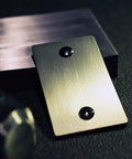 Close-up of titanium seed plate for beefed up security in crypto seed phrase storage for Bitcoin and Ethereum, includes 2 plates and seals.