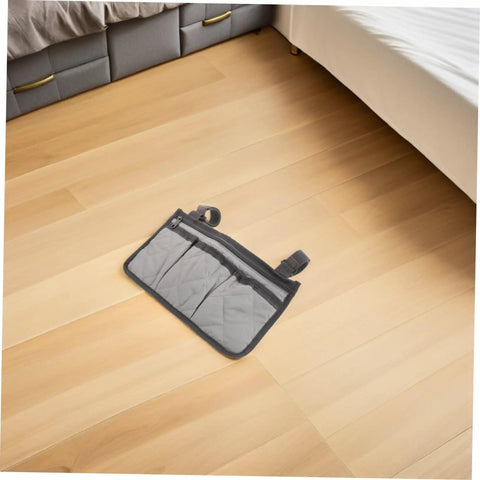 Senior Bedside Rail Organizer With Four Compartments And Cup Holder, Pongee Storage Bag on a wooden floor