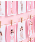 Top Shelf 100 Piece Mini Wooden Clothespins With Handy Storage Bag Dead Serious Grip Birch Hardwood Clips on a photo display.