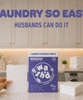 Heavy Duty Laundry Detergent Sheets Featuring 3x Stain Fighting Enzymes on kitchen counter with towels and washer.