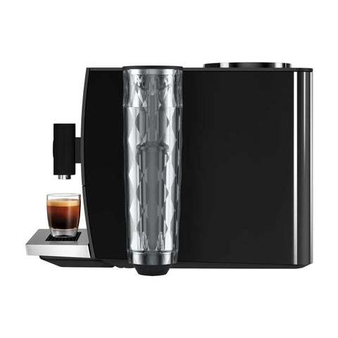 Step Up Your Home Brew Game With This Compact Automatic Coffee Machine Featuring A Pro Aroma Grinder And Super Simple Programmable Settings In Classic Metropolitan Black Color, side view showcasing the sleek design and espresso shot.