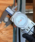 iGAGING 0-12" / 0-300mm Electronic Digital Caliper Full Color LCD Display with Real Time Dial Movement measuring a coin.