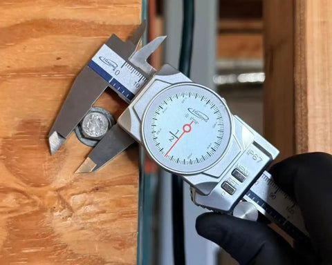 iGAGING 0-12" / 0-300mm Electronic Digital Caliper Full Color LCD Display with Real Time Dial Movement measuring a coin.