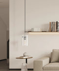 3 Pack Clear Glass Vintage Pendant Lights With Brushed Nickel Finish For Kitchen Island in modern living room setting.