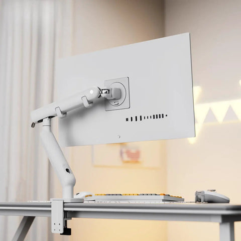 Ergonomic Desktop Monitor Mount With Buttery Smooth Mechanical Spring Arm For Single Screen, sleek white design on desk.