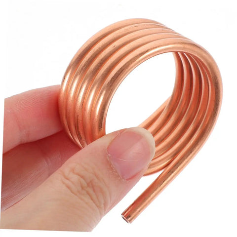 Close-up of copper Boat Motor Cooling Ring Water Cooling Sleeve For RC Yacht 540 Brush Motor Parts, hand holding a coil.