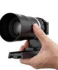 Close-up of Canon RF Mirrorless Astro Telephoto Lens 105mm F2.8 APO held in hand, RF mount adapter visible.