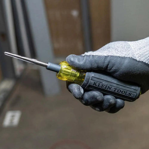 6 In 1 Tapping Tool From Klein Tools With Cushion Grip for repairing and cleaning threads shown held by gloved hand