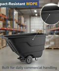 Rugged Build Tilt Truck Dump Cart Boasts Half Cubic Yard Volume And 300 Pound Weight Limit sturdy black MDPE carrier in warehouse.