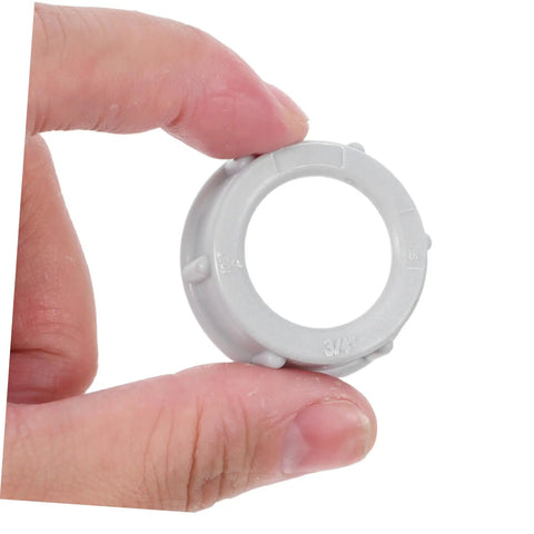 No Fuss 3/4 Inch Plastic Insulating Bushing being held, gray plastic for electrical fittings and strain relief.