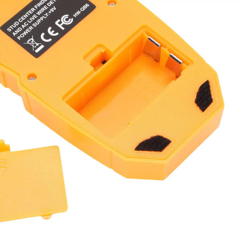 Close-up of the back of the FTVOGUE Wall Detector with LCD Display, Battery Powered Stud Finder, showing battery compartment.