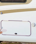 Person holding a Must-Have White Stainless Steel And Abs Baggage Door Catch Clip For Rv Trailer Camper, ready to secure storage.