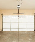 Garage Door Torsion Springs Pair With 0.218 Inch Wire, 2 Inch Inner Diameter, 24 Inch Length, visible on garage setup