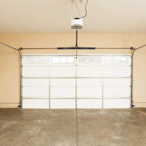 Garage Door Torsion Springs Pair With 0.218 Inch Wire, 2 Inch Inner Diameter, 24 Inch Length, visible on garage setup