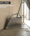 Heavy Duty Angle Broom Featuring Rigid Bristles And An Extended Handle That Smashes Through Stubborn Dirt And Leaves On Patios Garages And Commercial Floors Like Butter, cleaning corner debris.