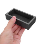 Heavy Lifter Graphite Crucible And Metal Smelting Mold Set With Integrated Oil Traps for seamless gold and silver casting held in hand.
