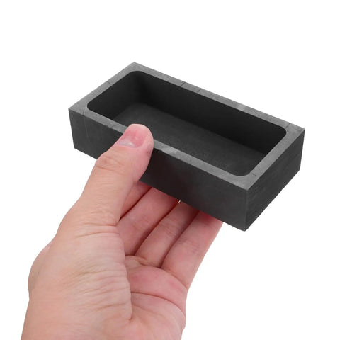 Heavy Lifter Graphite Crucible And Metal Smelting Mold Set With Integrated Oil Traps for seamless gold and silver casting held in hand.