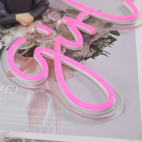 Close-up of Pink Girl Boss LED Neon Light Sign For Bedroom Desk Wall Decor, letter detail, clear flexible tubing, USB powered