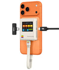 Classic Retro M2 NVMe PCIe Magnetic SSD Enclosure attached to an orange smartphone with LCD panel and USB connections.