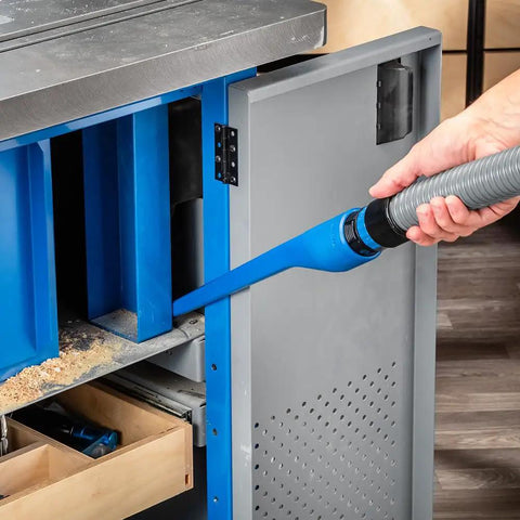 Using 15 Inch Click Connect Needle Nose Crevice Tool For Shop Vac Vacuum Cleaner to clean workshop cabinet