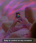Person using app to control Galaxy Projector Star Lights With Bluetooth Speaker And Remote Barred Spiral Milky Way Night Sky Projector