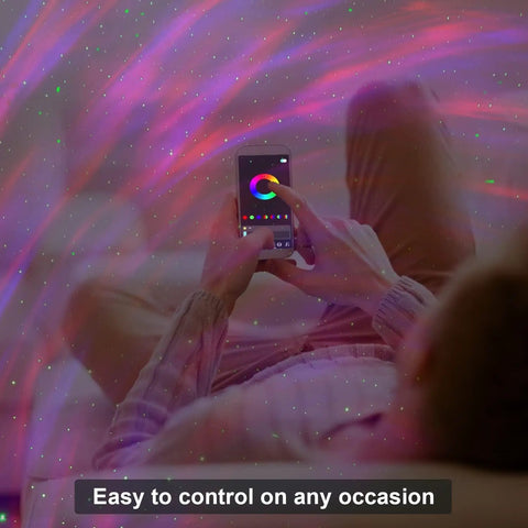Person using app to control Galaxy Projector Star Lights With Bluetooth Speaker And Remote Barred Spiral Milky Way Night Sky Projector