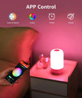 Smart Bedside Lamp With Alexa And Google Assistant, RGB Color Changing LED lamp on table, controlled by smartphone app.