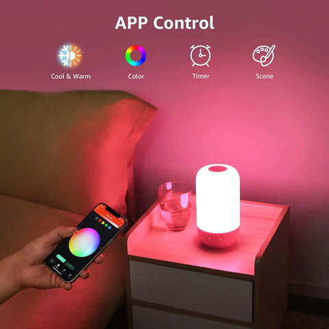Smart Bedside Lamp With Alexa And Google Assistant, RGB Color Changing LED lamp on table, controlled by smartphone app.
