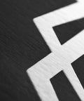 Close-up texture of black and white surface detail, not outdoor slackline starter kit components or accessories.
