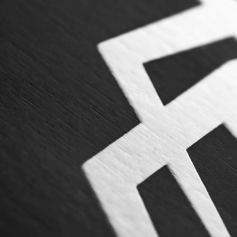 Close-up texture of black and white surface detail, not outdoor slackline starter kit components or accessories.