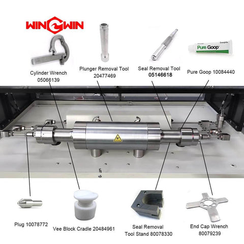 Front view of stainless steel waterjet spare parts kit featuring end cap wrench and plunger removal tool