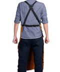 Back view of person wearing Rugged Heat Resistant Welding Apron With Six Tool Pockets, Heavy Duty Leather Forge Apron For Metalworking