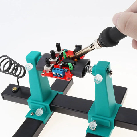 Adjustable PCB Holder Soldering Clamp For Circuit Boards With Soldering Iron Pen Holder And 360 Degree Rotation in use
