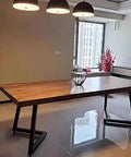 Heavy Duty Metal Double V Table Legs With Adjustable Leveling Pads To Straight Up Level Up Your Home Office Or Dining Room Setup For A Rock Solid Anti Rust Look That Fits Any Modern Desk Design Perfectly next to a wooden table.
