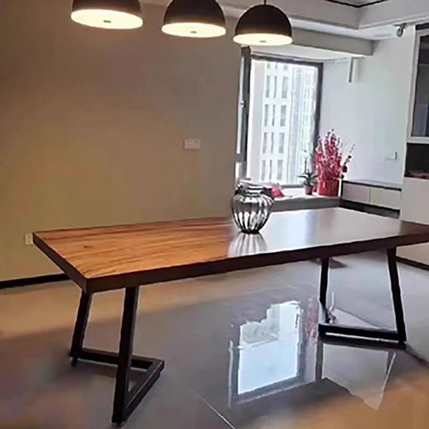 Heavy Duty Metal Double V Table Legs Featuring Adjustable Leveling Foot Pads Super Sturdy Base under a wooden table in a bright room.