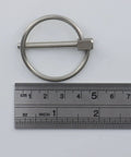 4 Pack Beefy Stainless Steel Locking Lynch Pins With Rings 1/8 To 1-3/8 Inch next to ruler for size reference