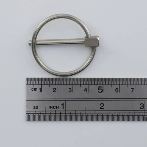 4 Pack Beefy Stainless Steel Locking Lynch Pins With Rings 1/8 To 1-3/8 Inch next to ruler for size reference